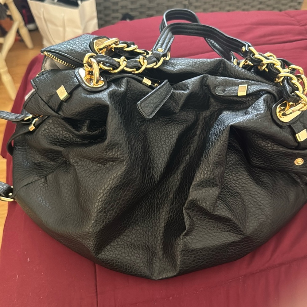 Black hobo bag with gold accents